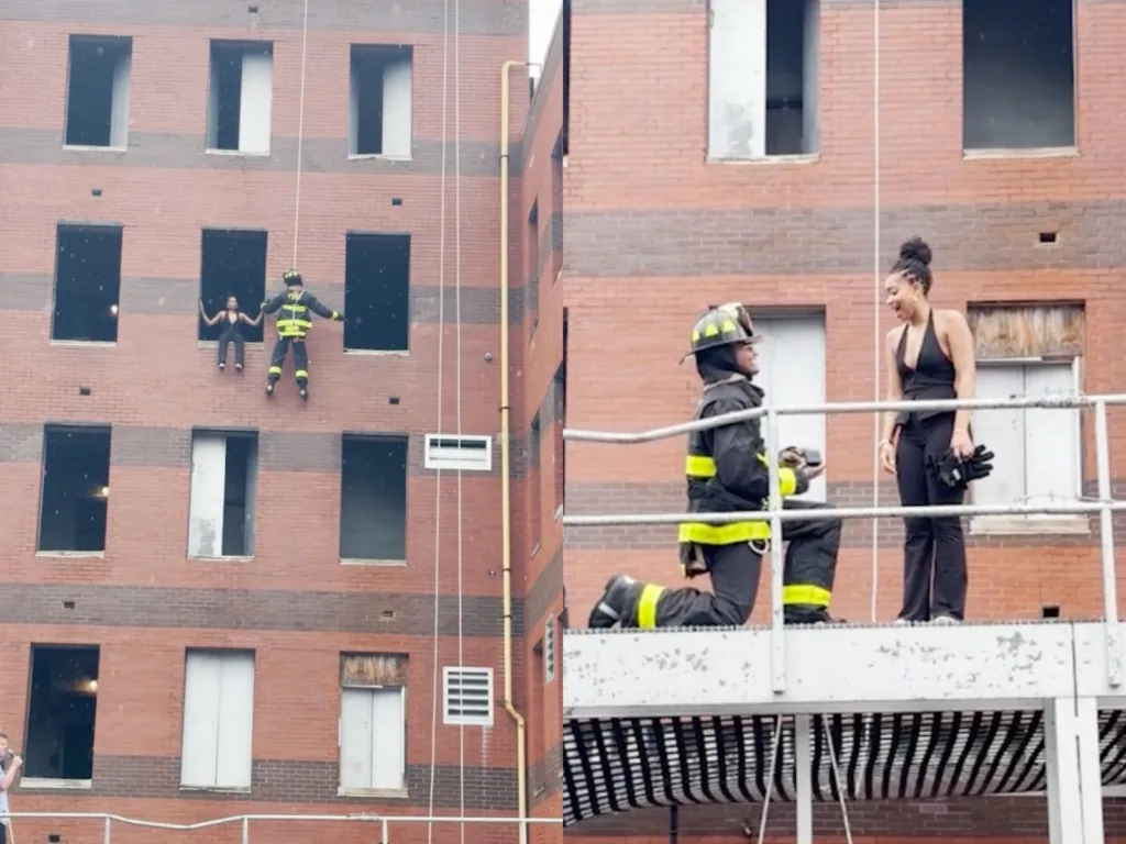Jayson rappels beside Dasia at a training-building window before kneeling to propose on a metal platform.