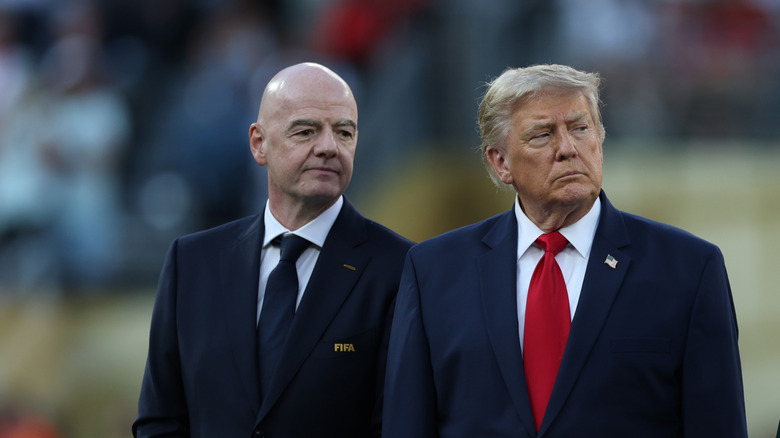Canadian Prime Minister Mark Carney stands next to U.S. President Donald Trump
