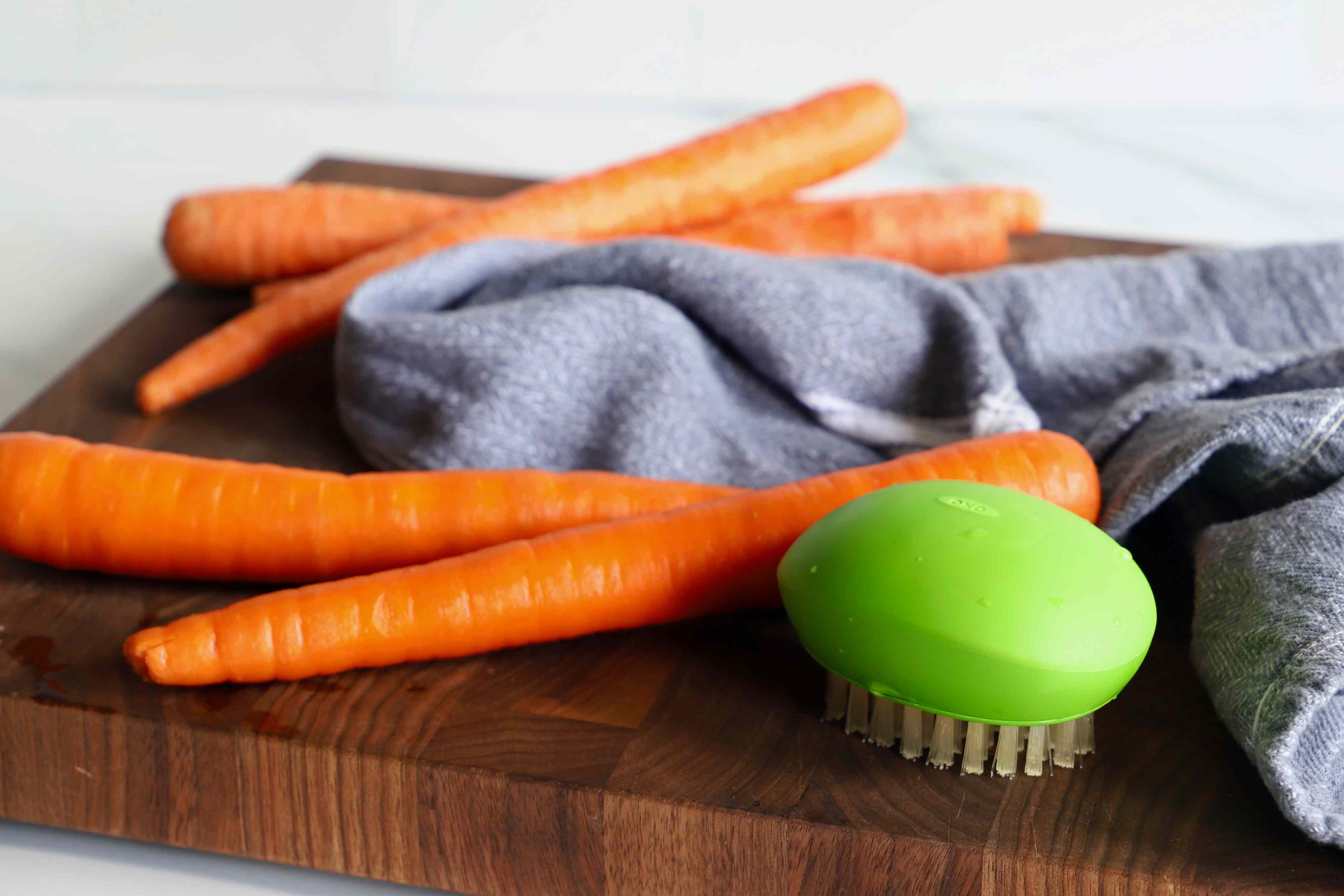 This OXO vegetable scrubber helps me clean my produce, save time, and reduce food waste