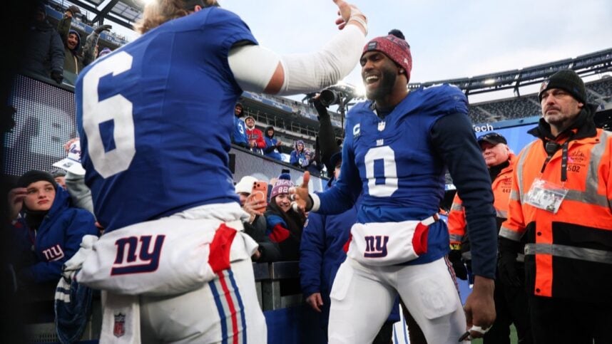 Brian Burns greeting a Giants teammate after a game