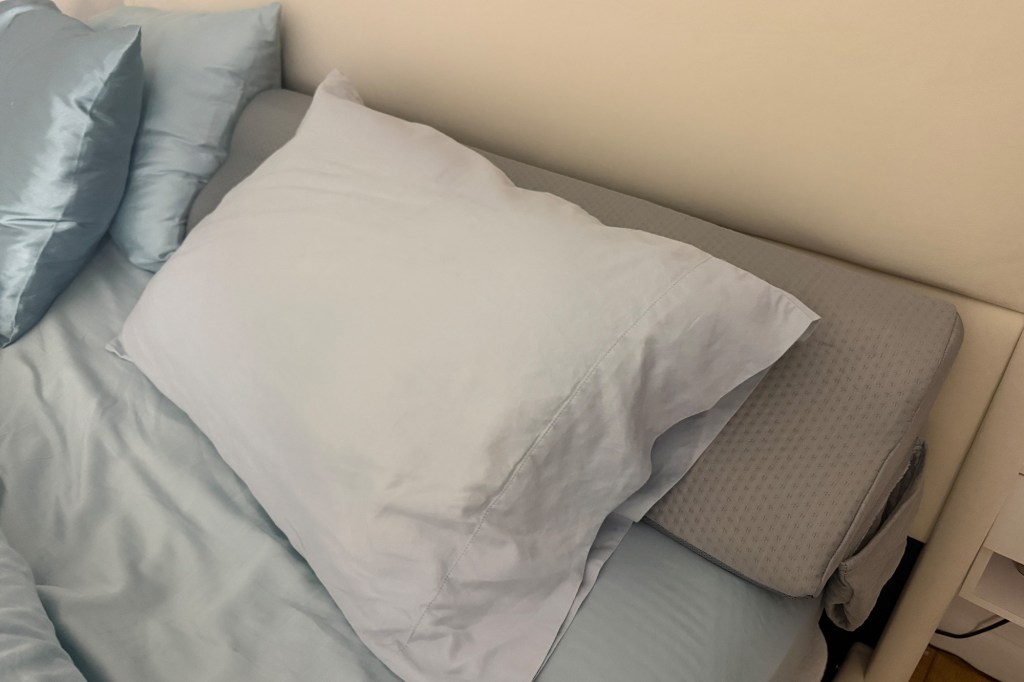 This plush pillow stops my essentials from disappearing in the cracks of my bed