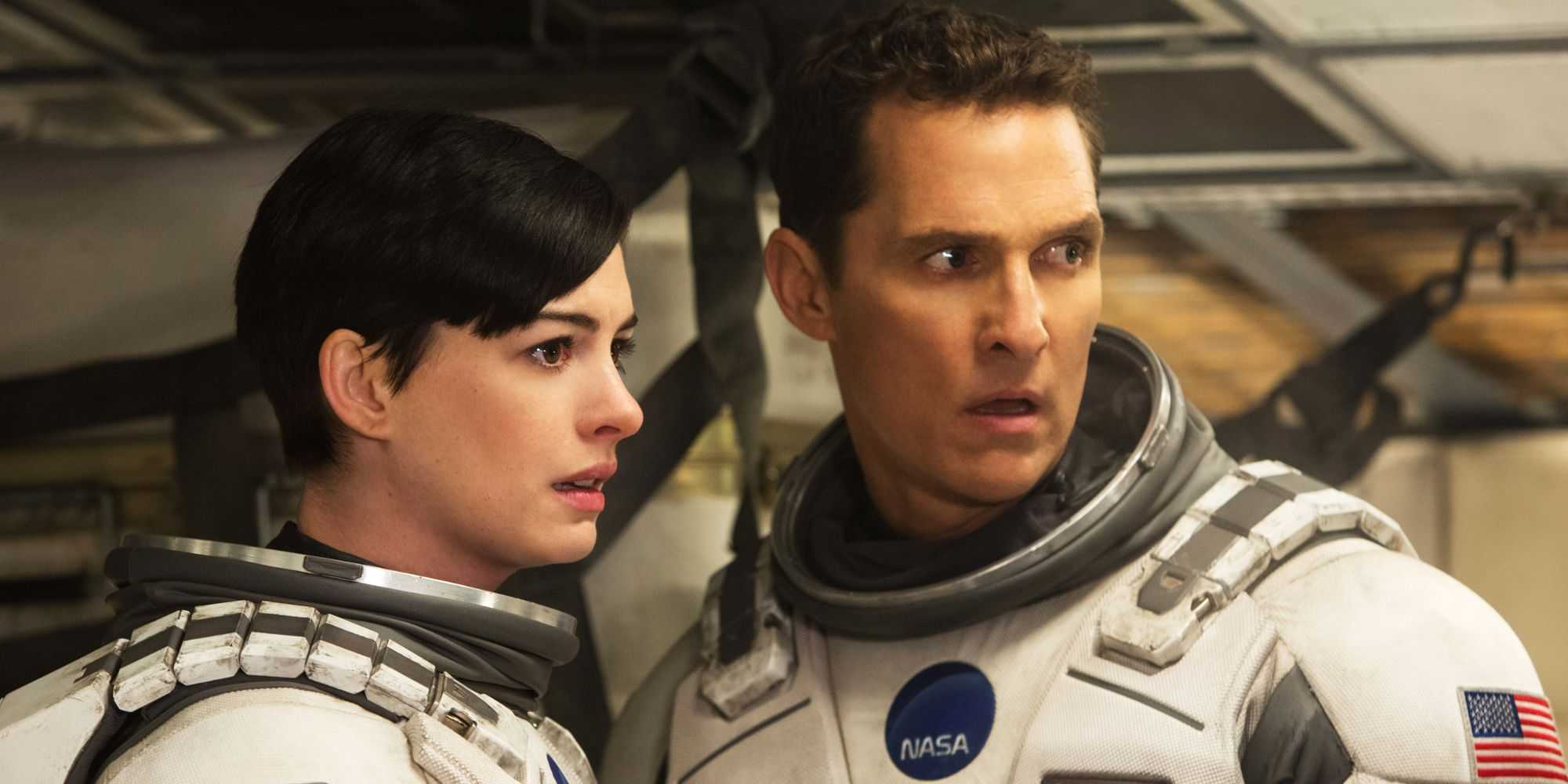 Coop and Brand in space suits in Interstellar.