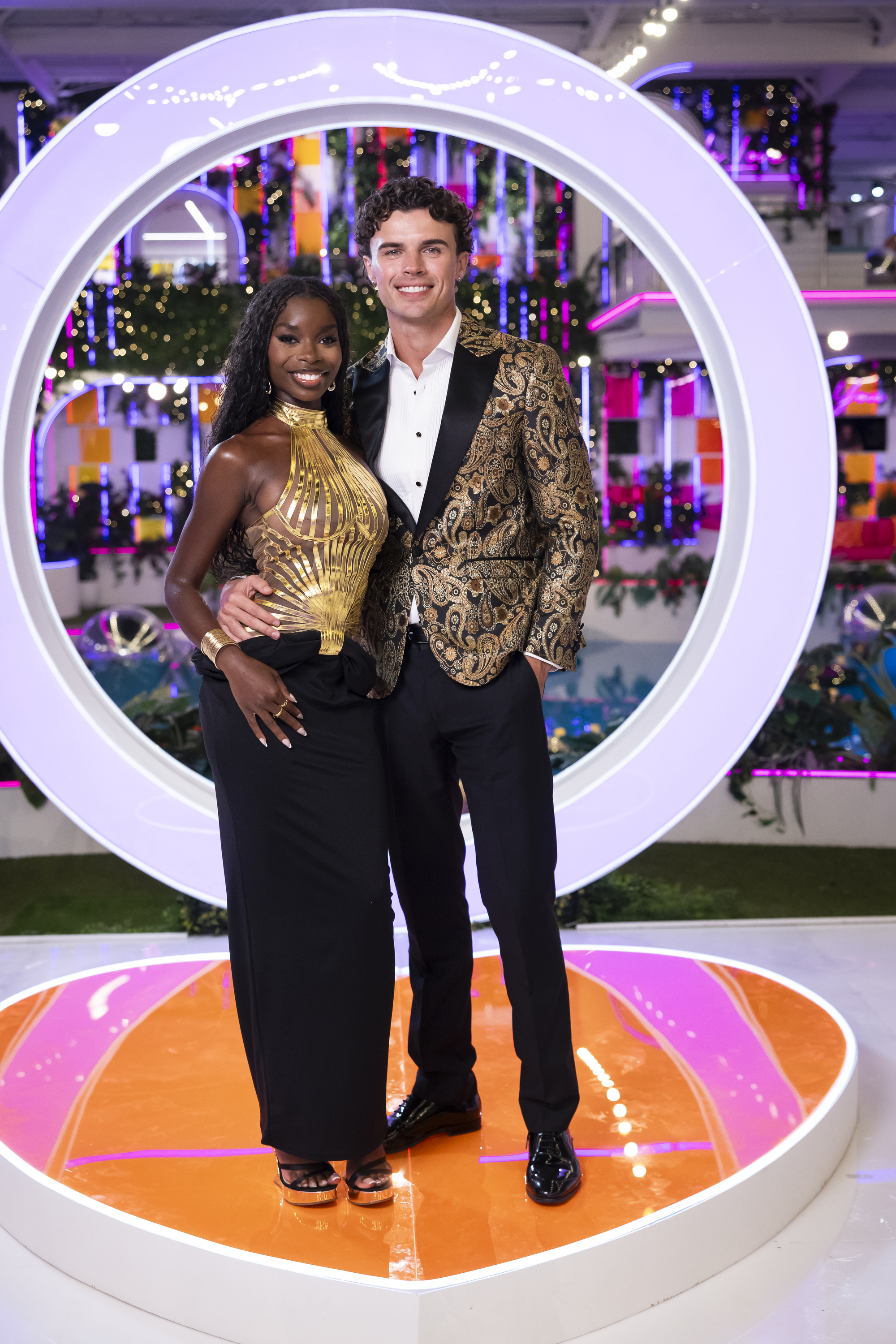 Olandria Carthen and Nicolas Vansteenberghe smiling at the camera at a Love Island event.