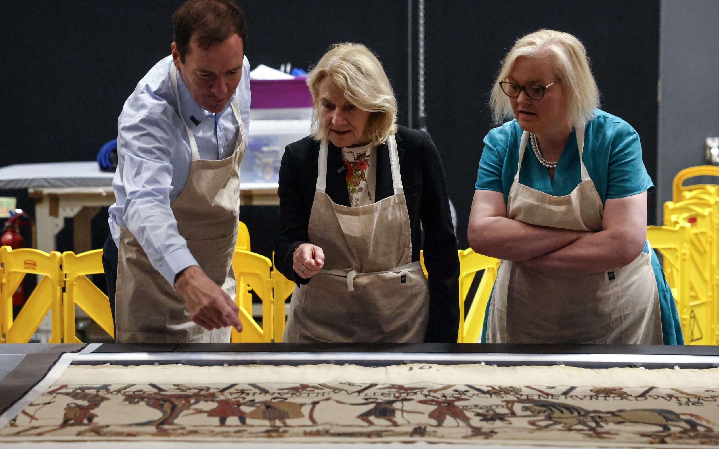 Cathier Pegard, centre, the French culture minister, inspects the tapestry at the British Museum, July 17