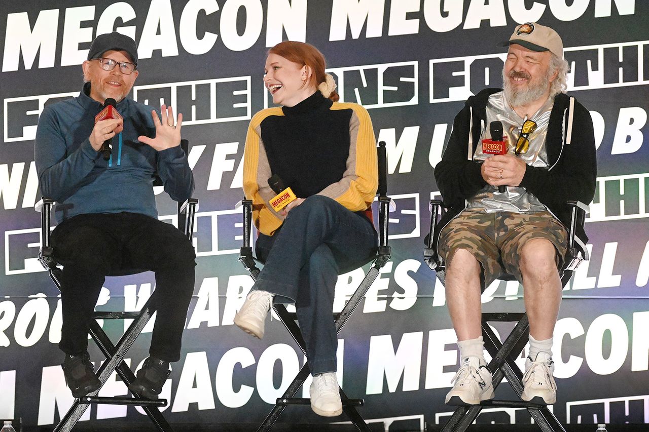 ORLANDO, FLORIDA - FEBRUARY 09: (L-R) Ron Howard, Bryce Dallas Howard, Clint Howard speak at MegaCon Orlando 2025 at Orange County Convention Center on February 09, 2025 in Orlando, Florida.