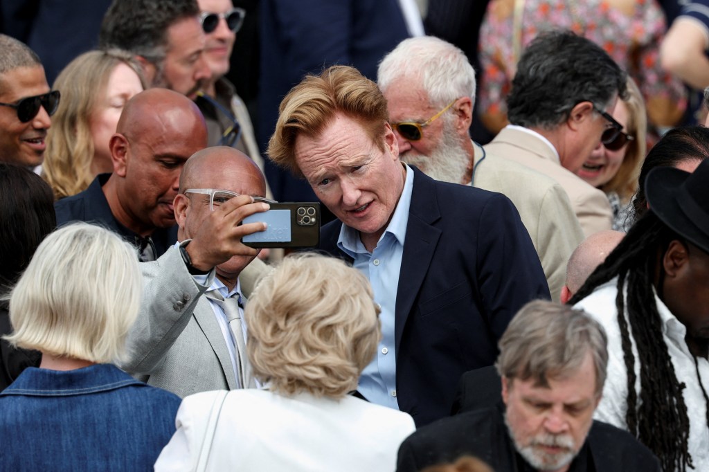 Conan O'Brien poses for a picture during the dedication ceremony for the opening of the Obama Presidential Center in Chicago.