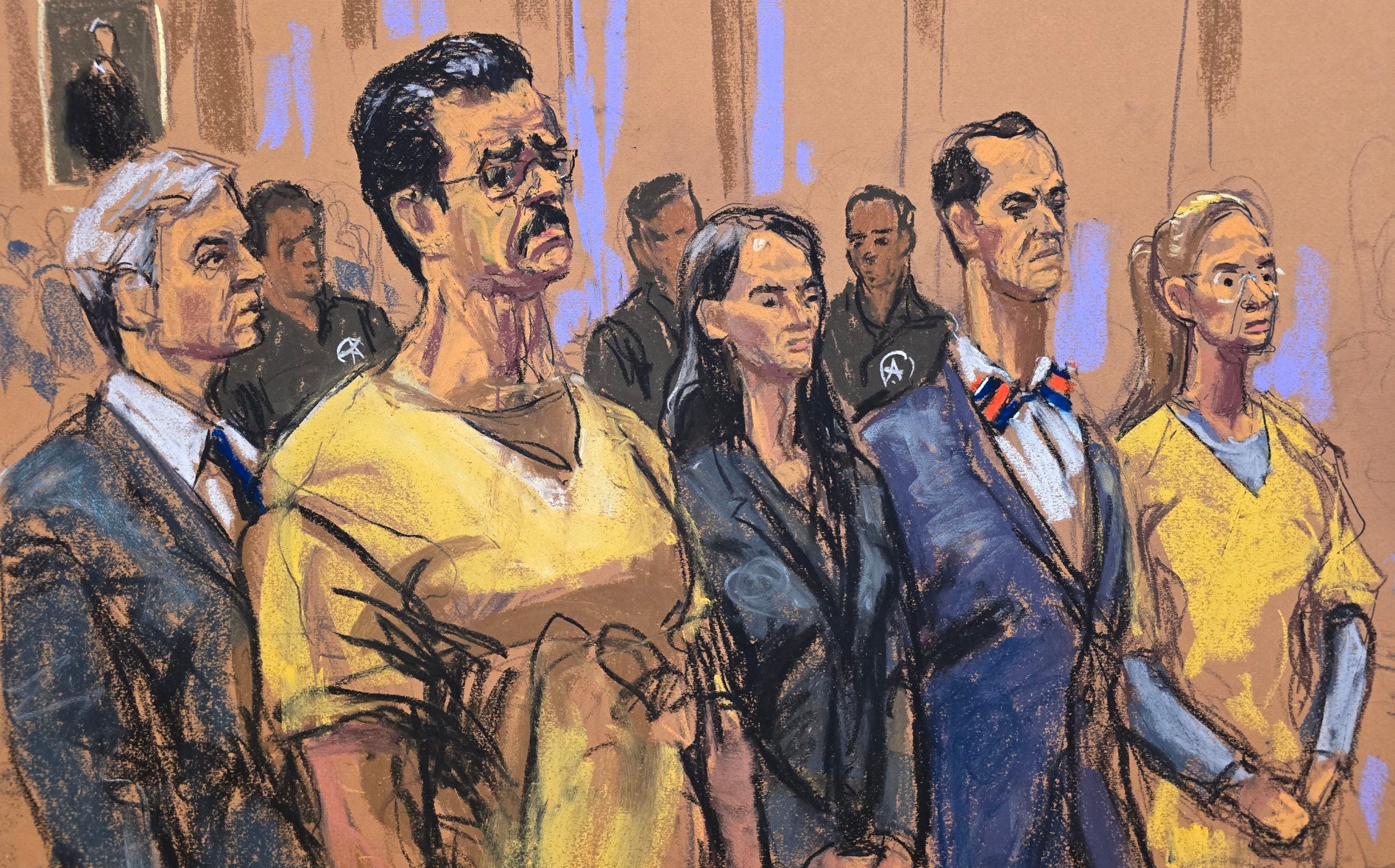 Nicolás Maduro and his wife Cilia Flores (both in yellow) stand during a pretrial hearing in New York on July 22