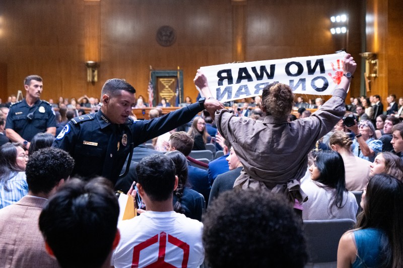 UNITED STATES - JULY 21: U.S. Capitol Police move in to remove anti-war protesters interrupting Secretary of Defense Pete Hegseth testifying during the Senate Appropriations Committee hearing on
