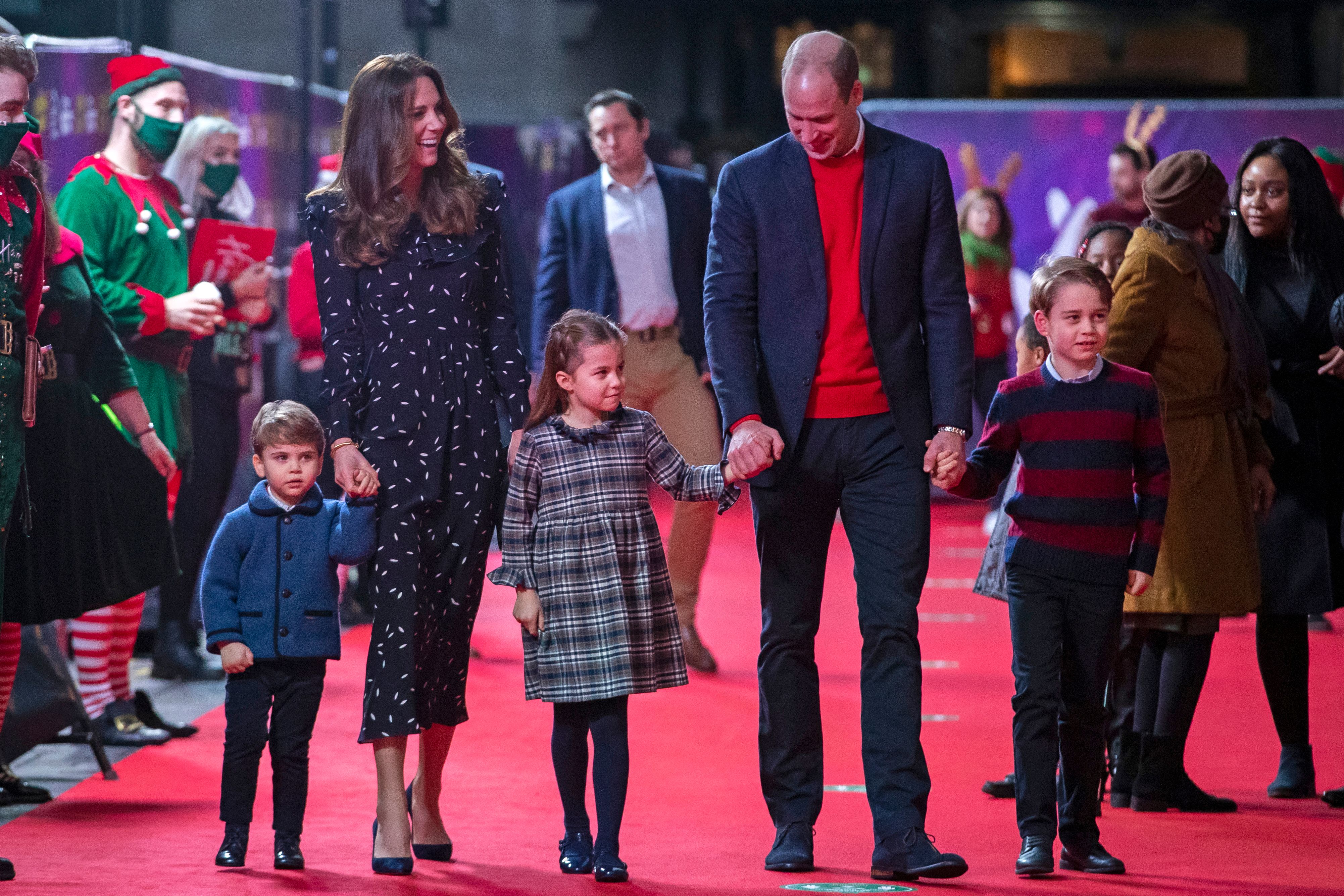 Britain's Prince William, Duke of Cambridge, his wife Britain's Catherine, Duchess of Cambridge, and their children Britain's Prince George of Cambridge (R), Britain's Princess Charlotte of Cambridge (3rd L) and Britain's Prince Louis of Cambridge (L) arrive to attend a special pantomime performance of The National Lotterys Pantoland at London's Palladium Theatre in London on December 11, 2020, to thank key workers and their families for their efforts throughout the pandemic.