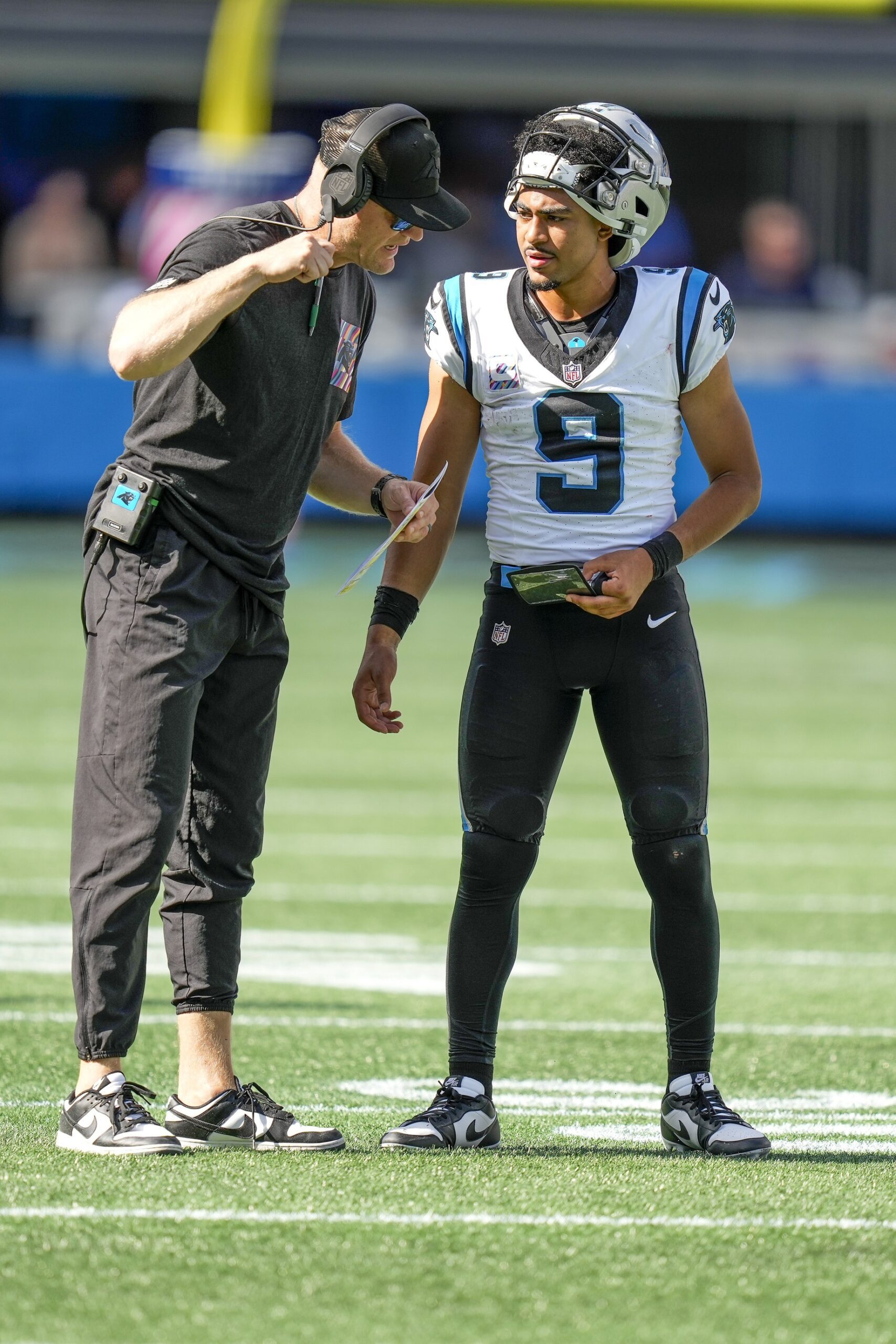 Oct 1, 2023; Charlotte, North Carolina, USA; Quarterbacks coach Josh McCown talks with Carolina Panthers quarterback Bryce Young (9) during a time out during the second half against the Minnesota Vikings at Bank of America Stadium. Mandatory Credit: Jim Dedmon-USA TODAY Sports