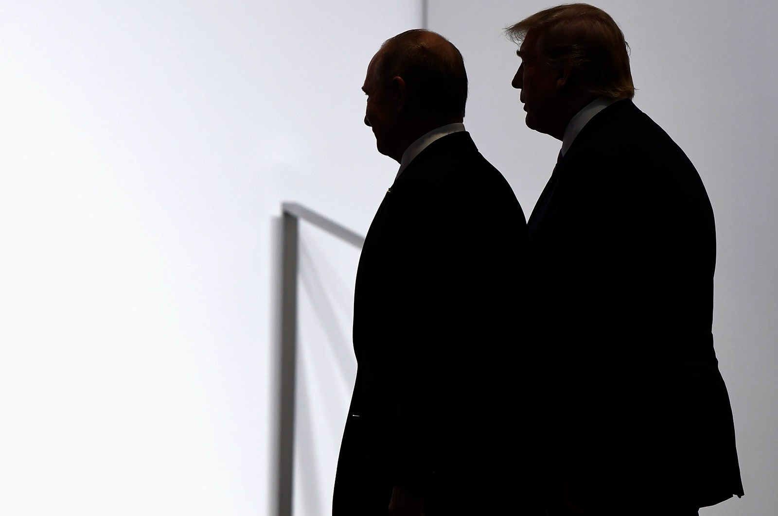 President Donald Trump and Russian President Vladimir Putin walk together at the G20 summit in Osaka, Japan, on June 28, 2019.