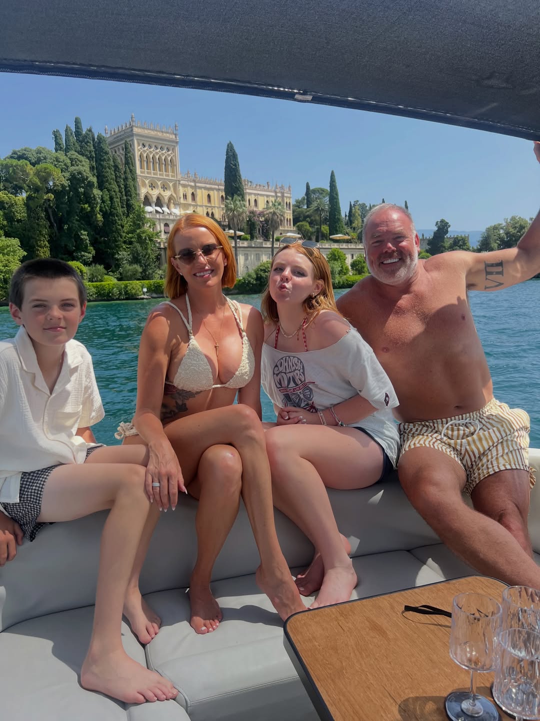 Whtiney and Justin Rose with their children on a boat.