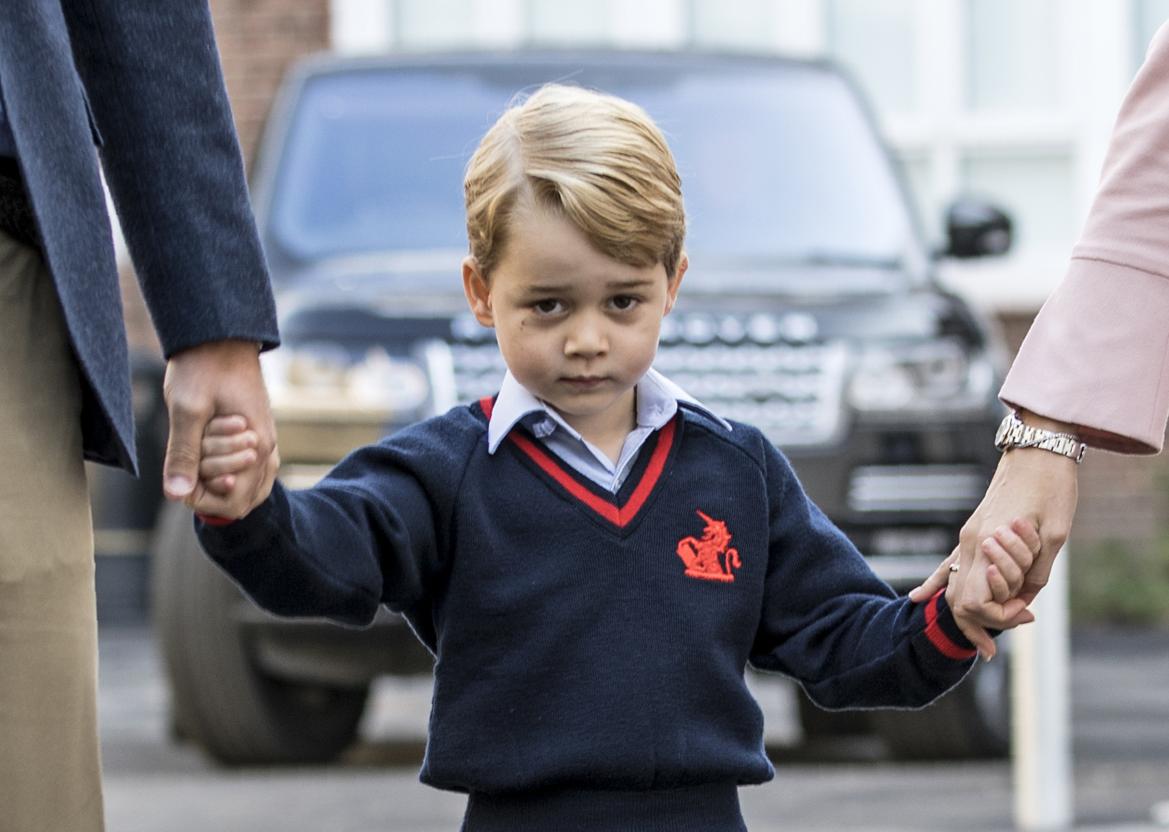 Prince George, accompanied by Prince William, arrives for his first day of school at Thomas's school where he is met by Helen Haslem head of the lower school in southwest London on September 7, 2017.