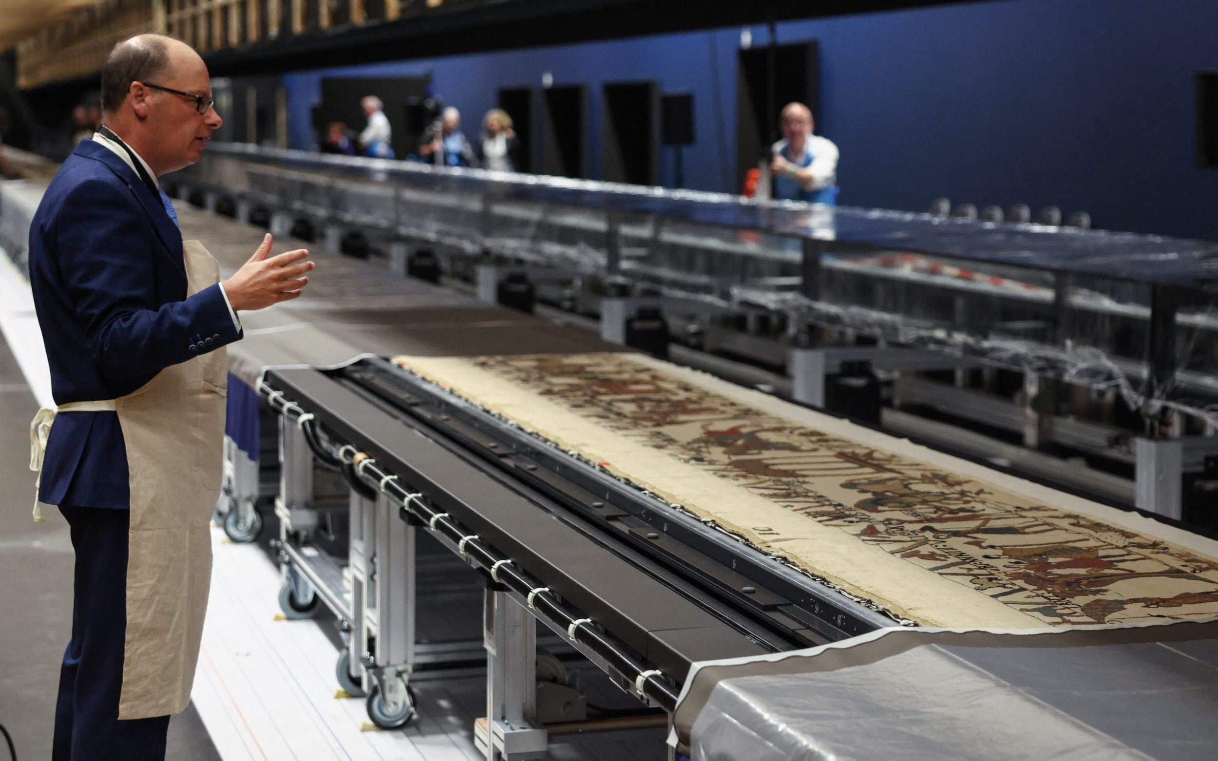 Michael Lewis, lead curator of the exhibition, speaks during the unveiling of the Bayeux Tapestry at the British Museum, July 17