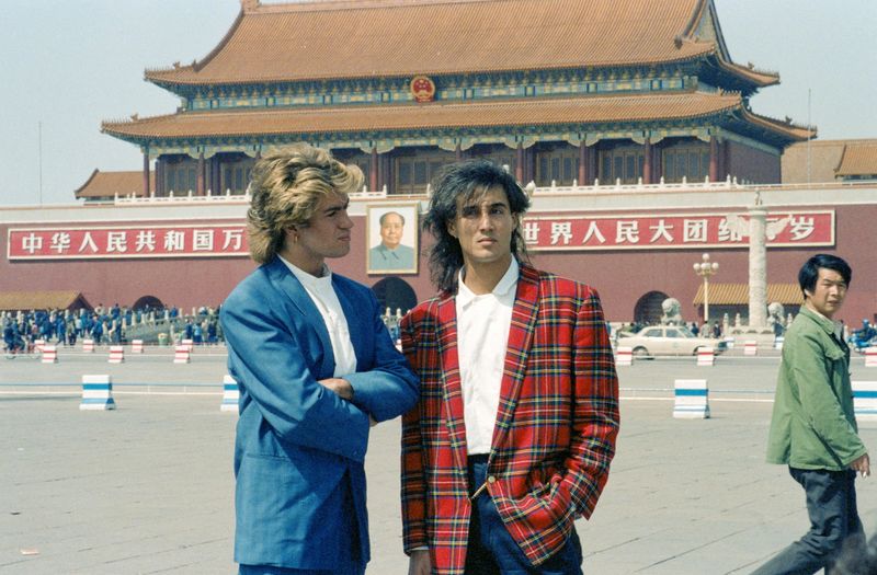 FILE PHOTO: Wham! members George Michael and Andrew Ridgeley visit Tiananmen Square in Beijing