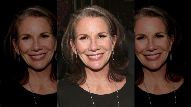 Melissa Gilbert smiles with a layered bob featuring gray roots
