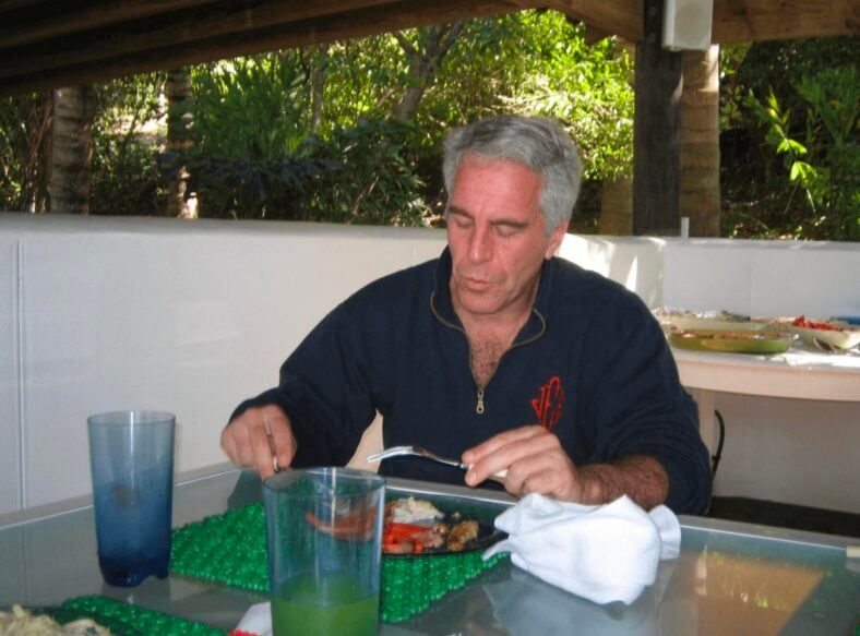 Jeffrey Epstein posing with a 'Champion' Belt with his name on it and with what appears to be a child in these undated photo released by the U.S. Department of Justice