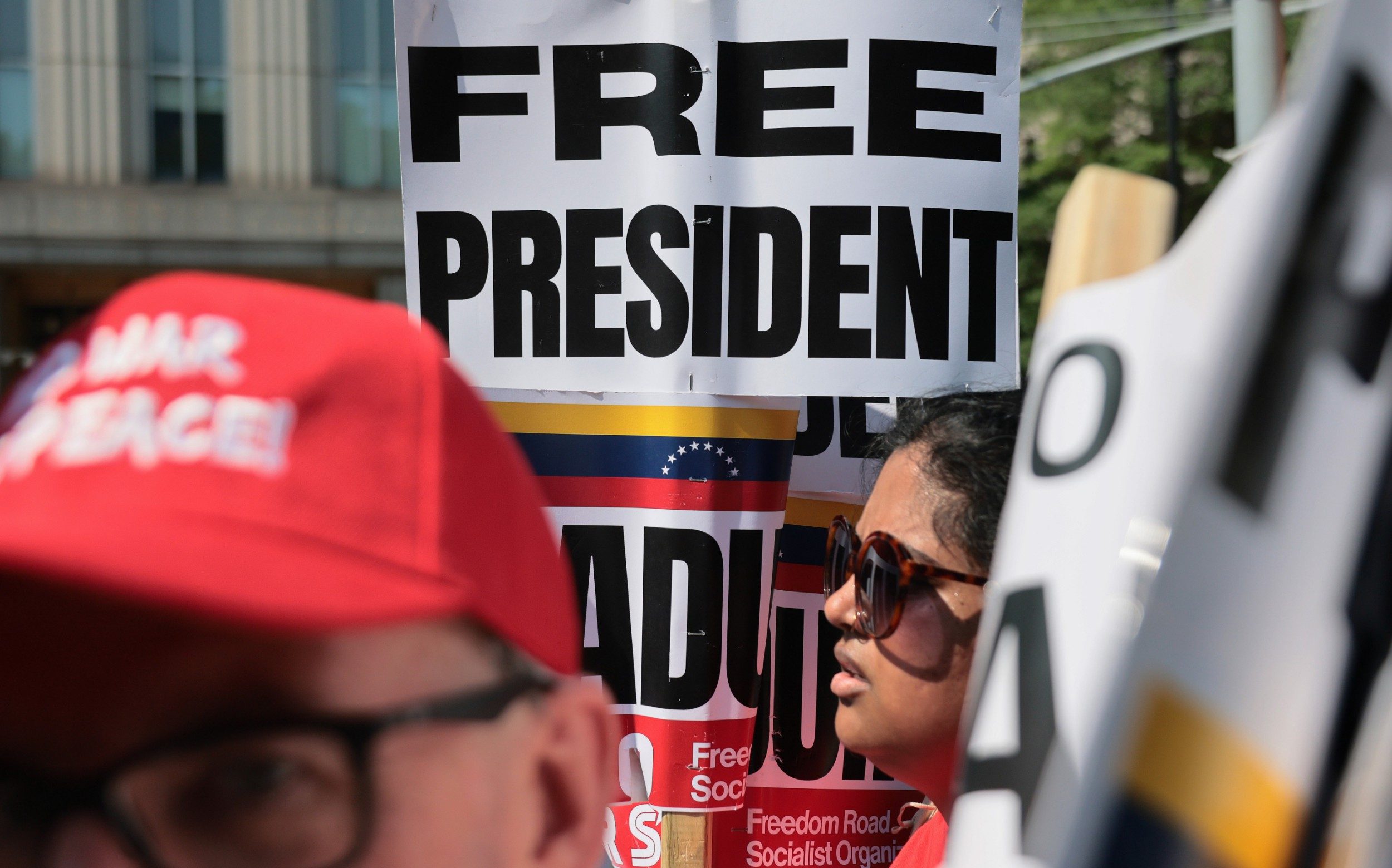 Supporters of ousted president Nicolás Maduro protest outside the courthouse
