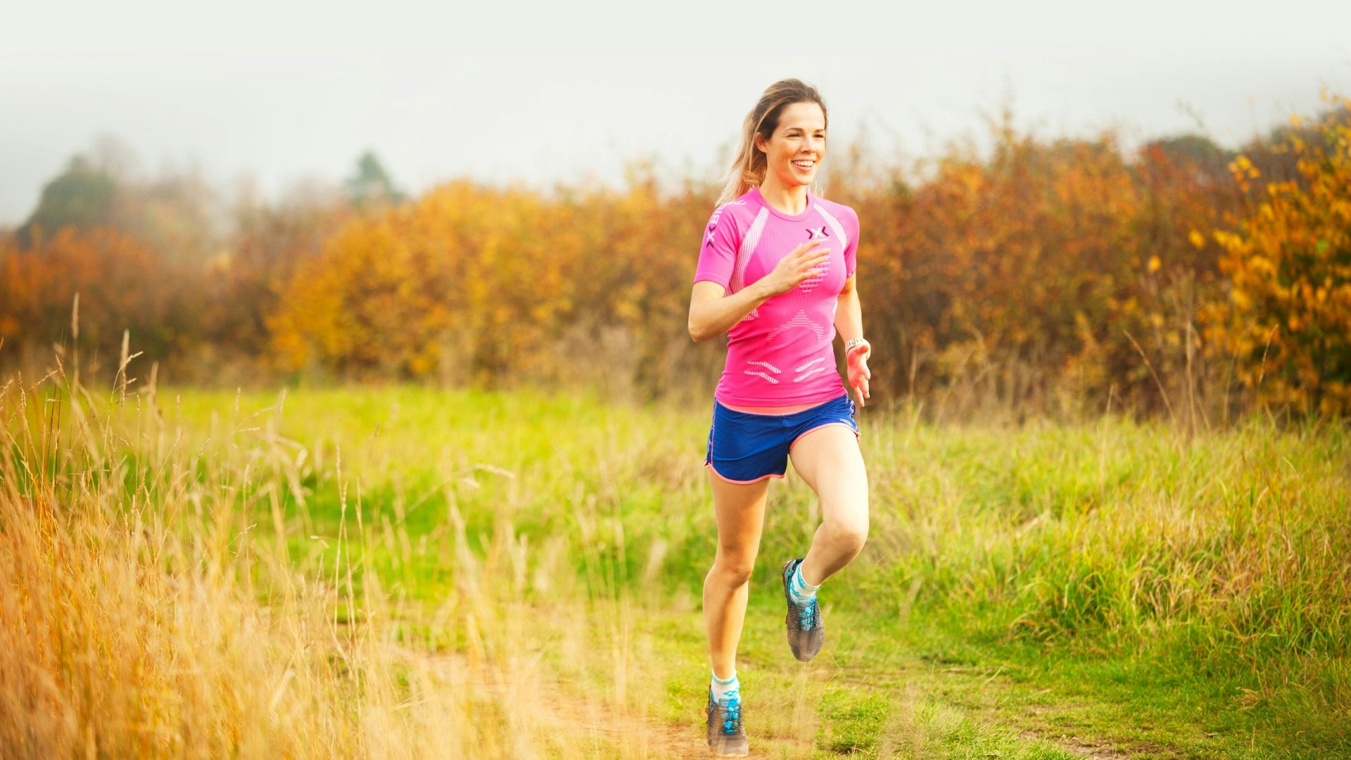 A women running through a field