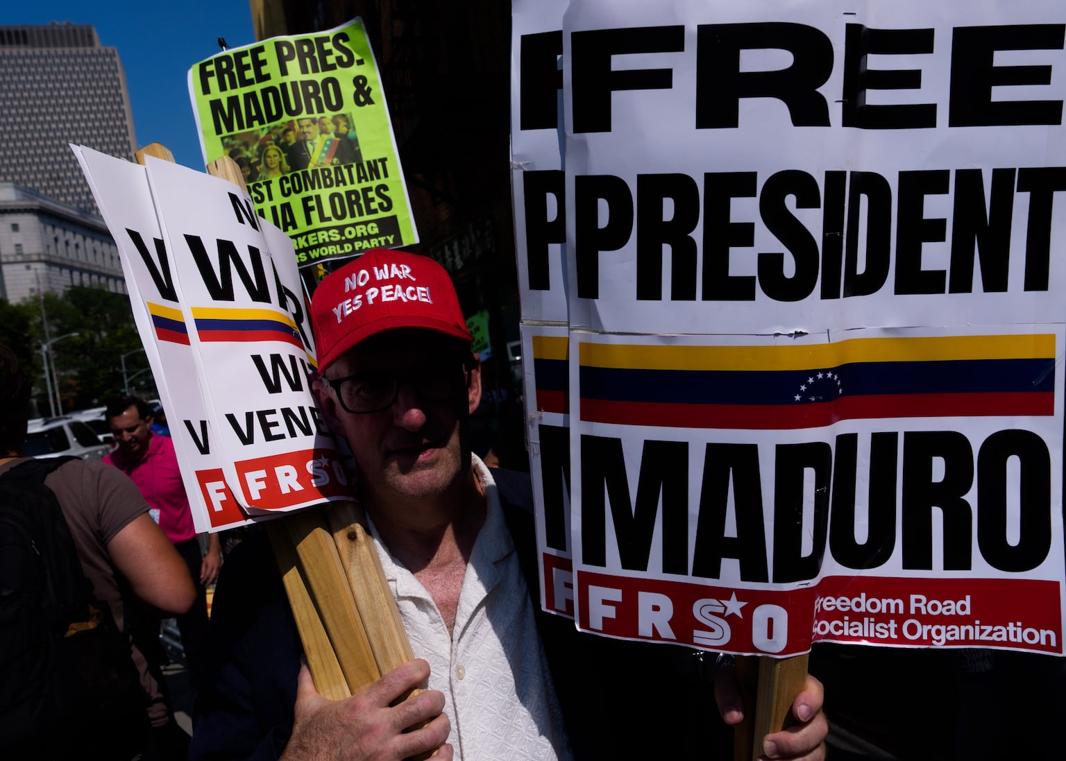 People protest in support of Nicolas Maduro and his wife outside the court in New York (Adam Gray/AP)