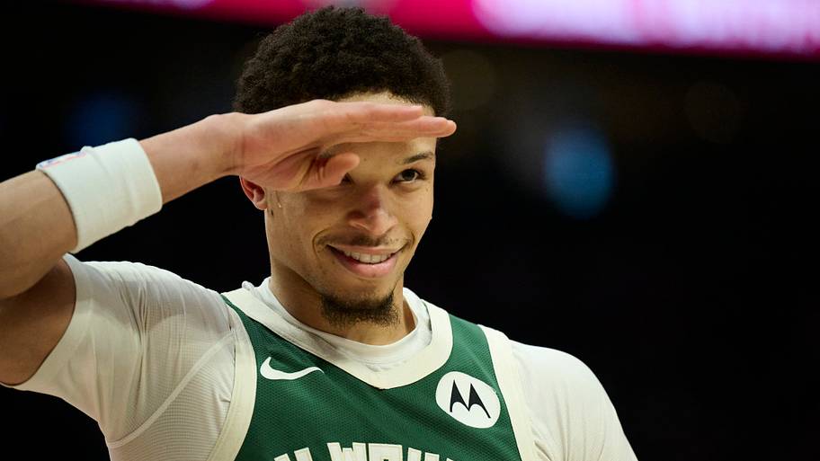 Milwaukee Bucks guard Ryan Rollins (13) salutes a fan during the first half against the Portland Trail Blazers