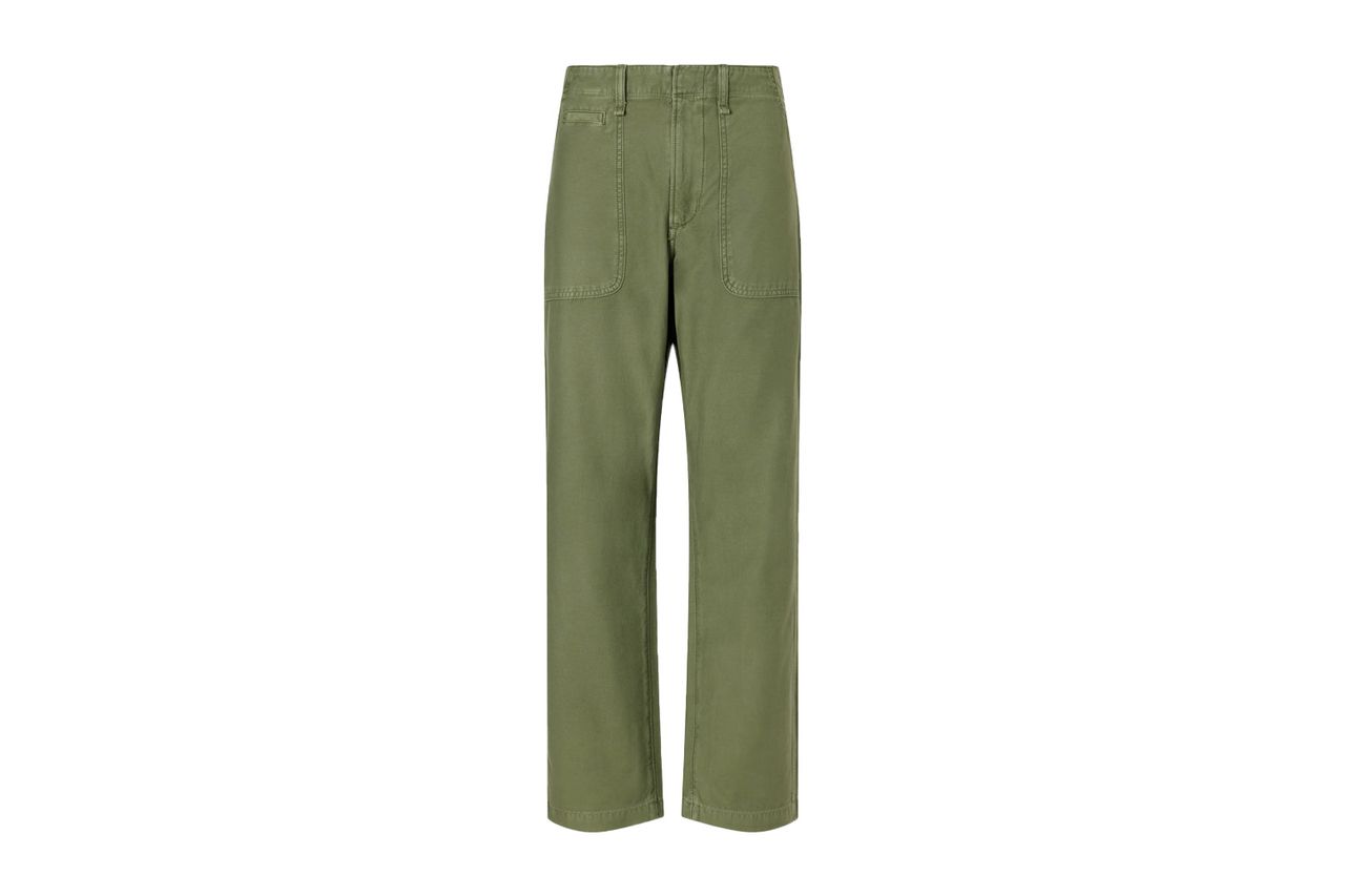 A pair of khaki trousers with front patch pockets on a white background