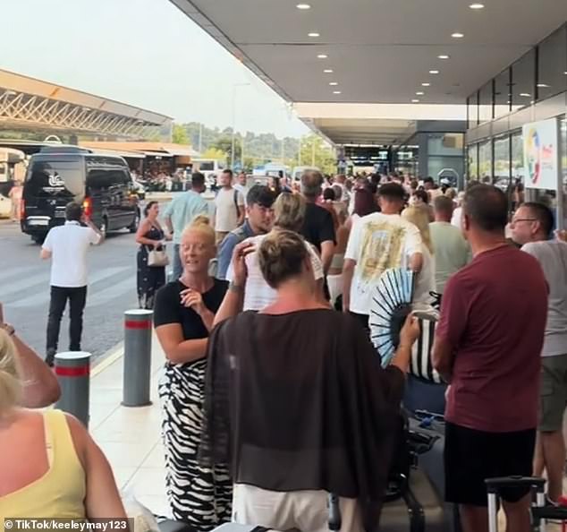 Footage taken from Corfu Airport and shared to social media showed a long line of disgruntled flyers waiting on the pavement outside the airport
