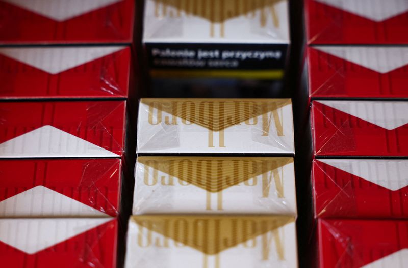 Philip Morris cuts annual profit forecast