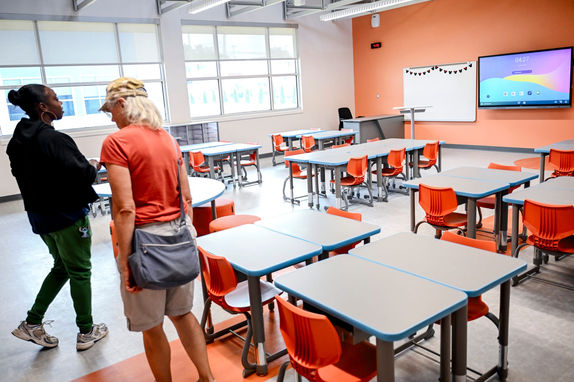 Guests tour a classroom in the kindergarten-second grade building at the new Willow School on Tuesday, July 21, 2026, in Lansing.