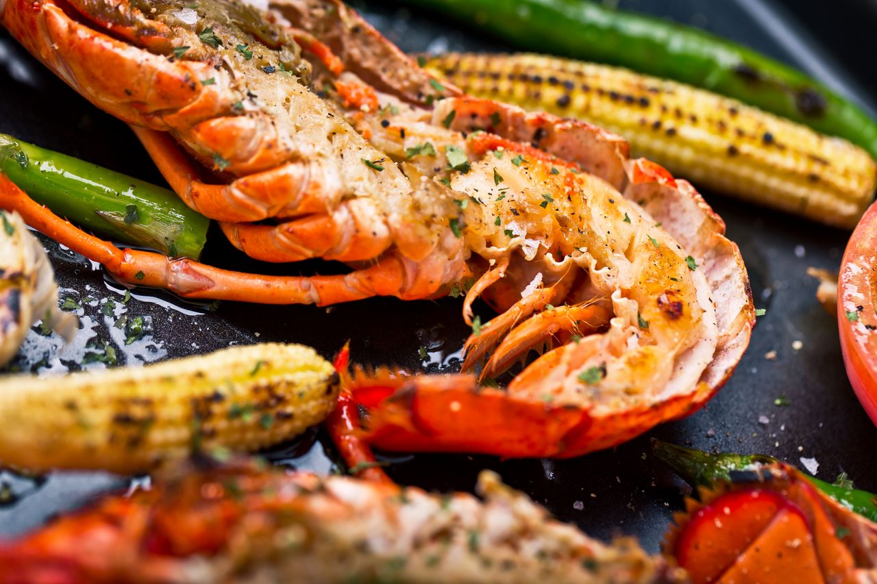 Grilled lobster along with asparagus, corn, tomato
