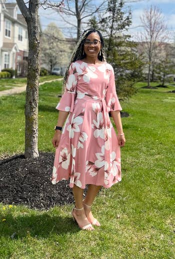 reviewer in pink floral dress