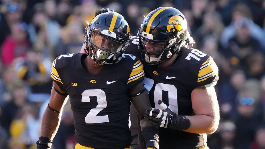 Iowa offensive lineman Beau Stephens (70) celebrates with running back Kaleb Johnson in the second quarter