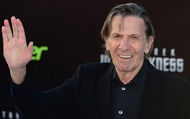 Leonard Nimoy, who played the role of Spock in the original Star Trek television series, waves on arrival for the Los Angeles premiere of the movie ‘Star Trek Into Darkness” in Hollywood, California, in this May 14, 2013, file photo. (Photo credit: AFP/Frederic J. BROWN/FILES)