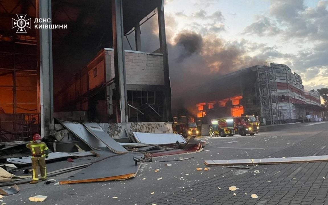 Rescuers putting out a fire in a logistics facility and warehouses following missile strikes on the Bucha district, near Ukrainian capital of Kyiv,