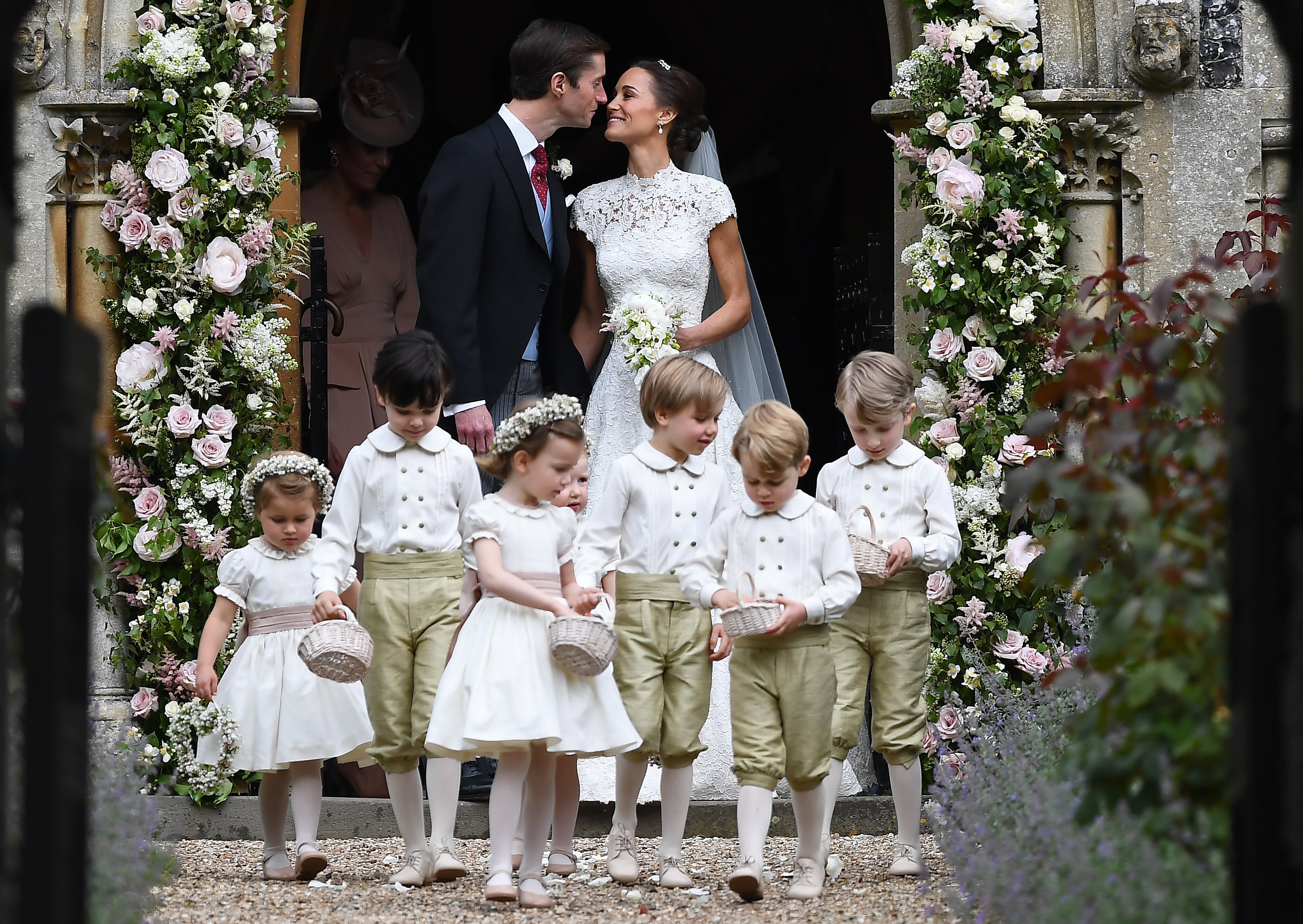 2017: Pippa Middleton kisses her new husband James Matthews following their wedding ceremony at St Mark's Church as the bridesmaids and pageboys walk ahead on May 20, 2017, in Englefield Green, England.