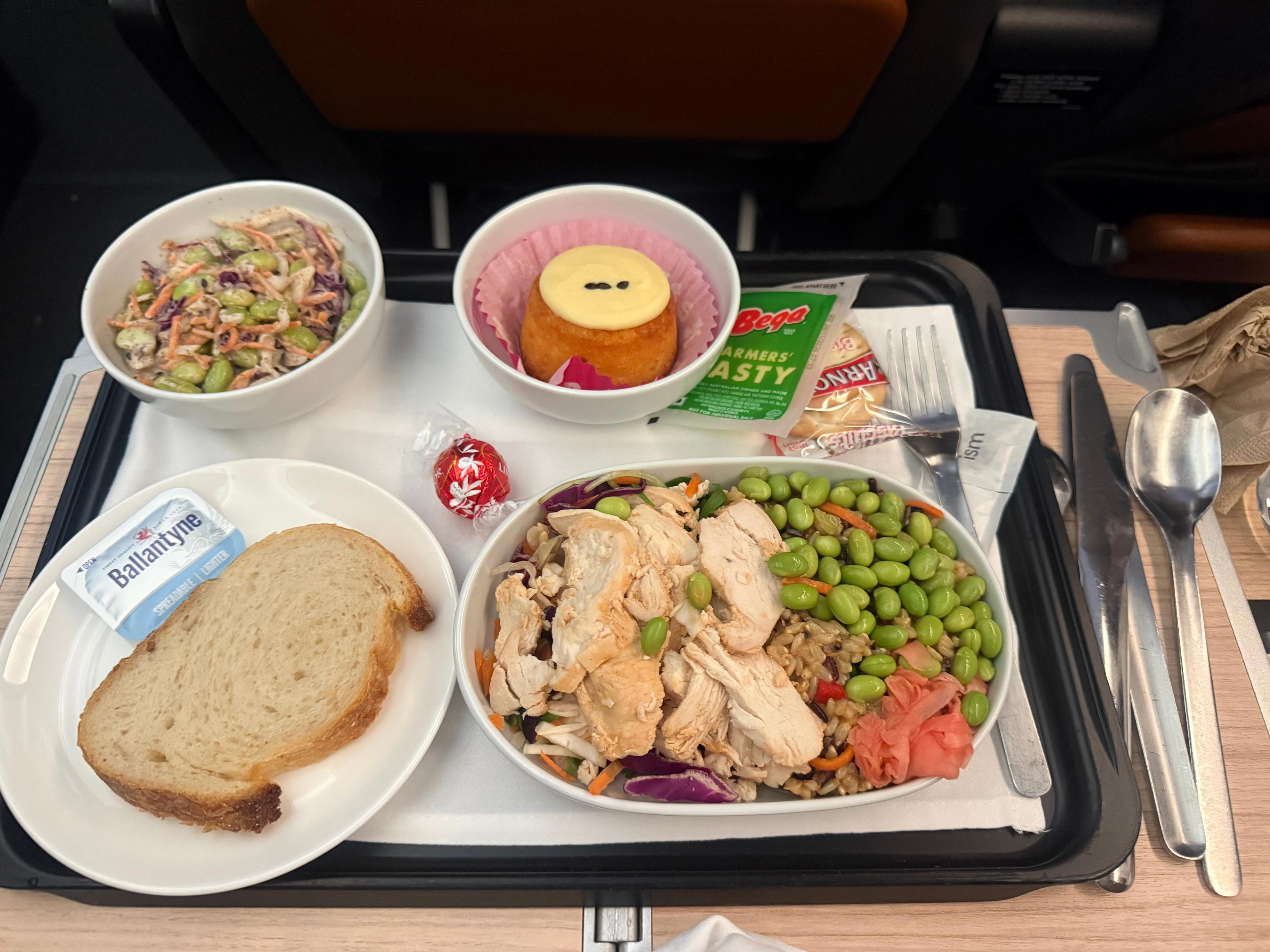 Tray of lunch with food on dishes on Qantas premium flight