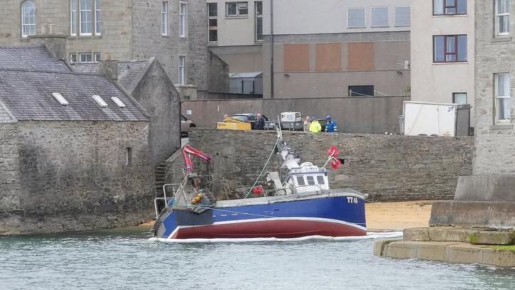 Fishing boat runs aground on Lerwick beach