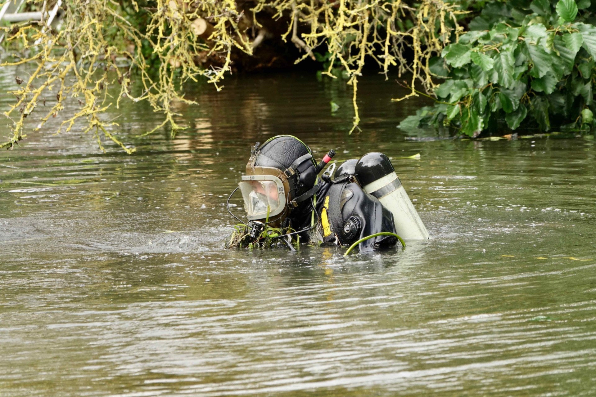 Police diver in the river.