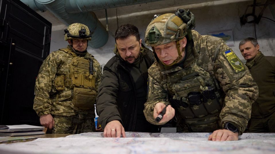 Zelensky listens to Oleksandr Syrskyi as he visits a position of Ukrainian servicemen in the town of Kupiansk on November 30, 2023. - Ukrainian Presidential Press Service/Reuters