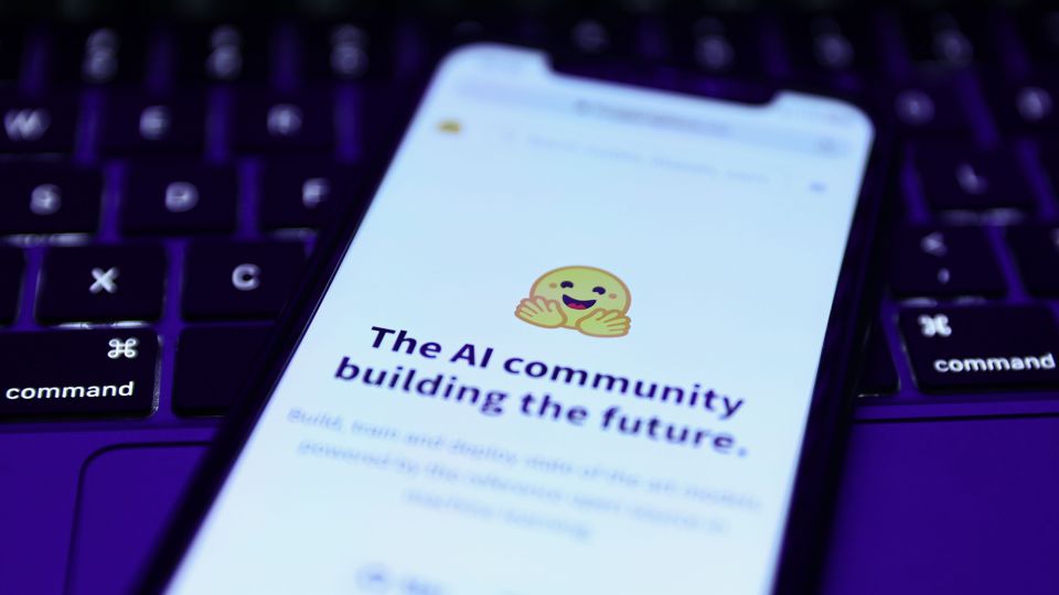 Hugging Face website displayed on a phone screen and a laptop keyboard are seen in this illustration photo. - Jakub Porzycki/NurPhoto/Shutterstock