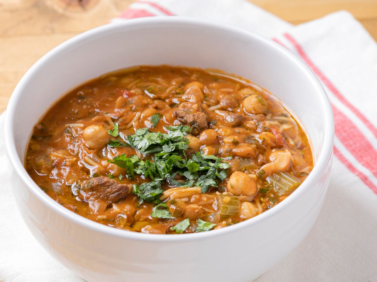 Moroccan harira soup served in a white bowl.