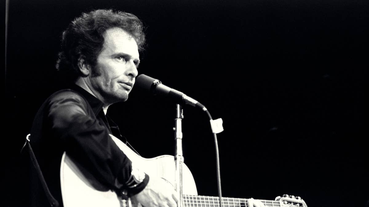 merle-haggard-performing-live-on-stage-with-guitar