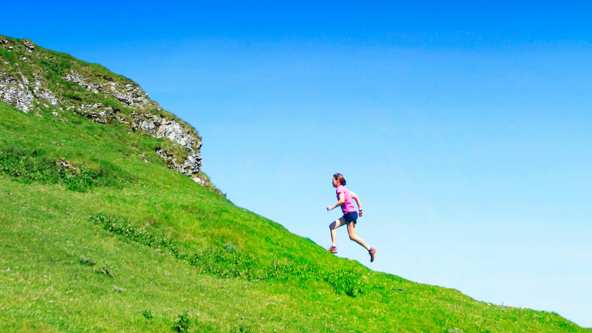 A lady running up a hill