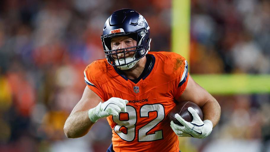 Nov 30, 2025; Landover, Maryland, USA; Denver Broncos tight end Adam Trautman (82) carries the ball after a reception against