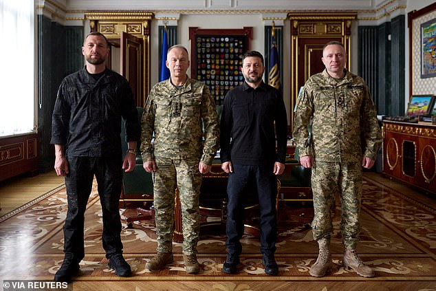 Ukraine's President Volodymyr Zelensky, newly appointed Commander-in-Chief of the Ukrainian Armed Forces Major General Mykhailo Drapatyi, his predecessor General Oleksandr Syrskyi, and Acting Defence Minister Yevhenii Khmara