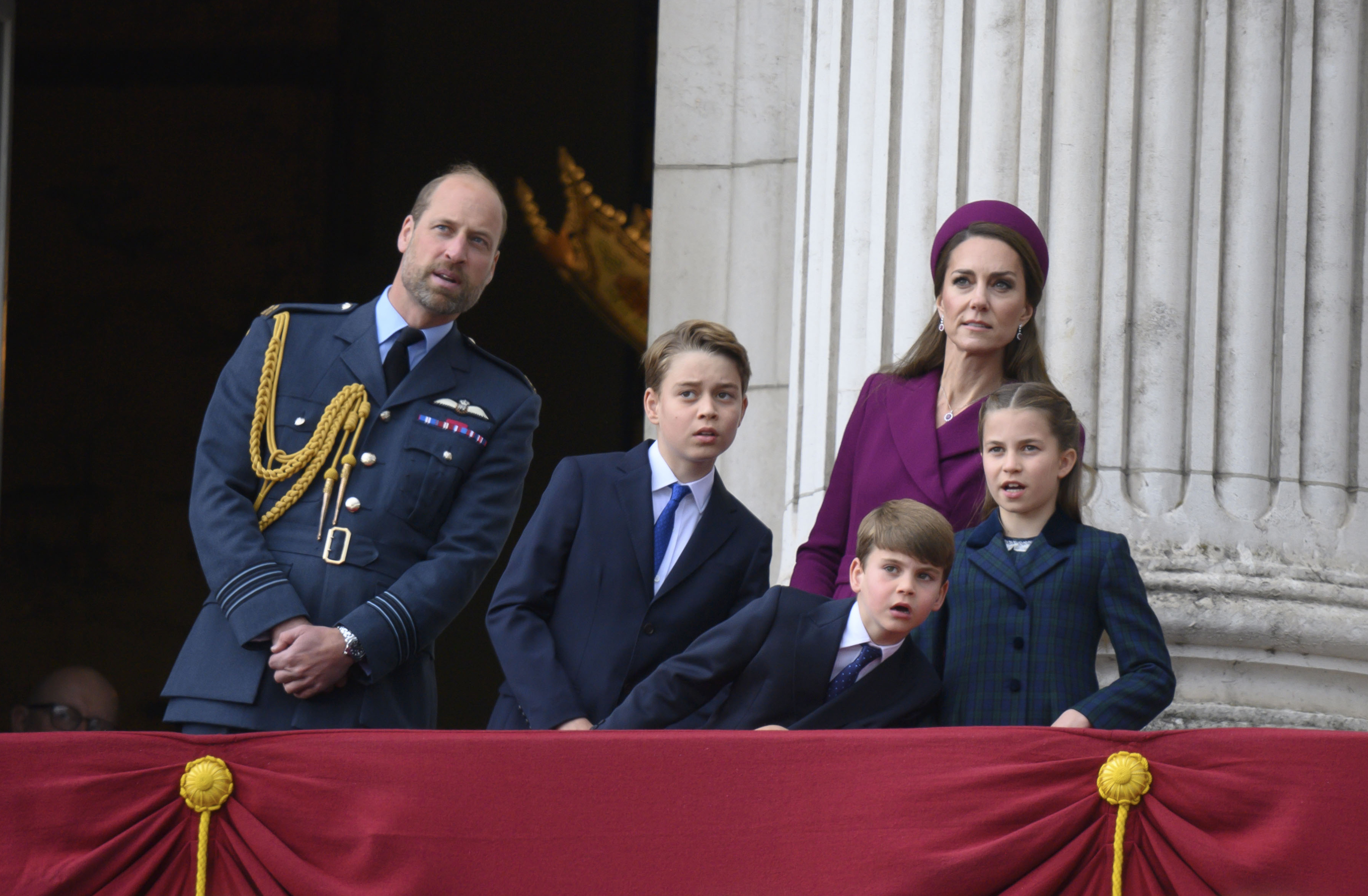 King Charles III, Queen Camilla, with other members of the Royal Family on the balcony at Buckingham Palace to watch the flypast...Other family members: Prince William, Prince of Wales, Catherine, Princess of Wales, Prince George, Princess Charlotte, Prince Louis.