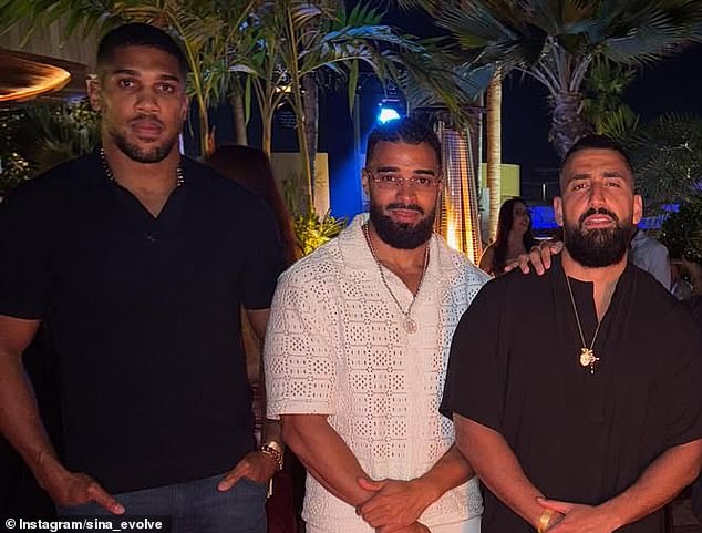 Joshua pictured with friends Latif Ayodele (centre) and Sina Ghami who both died in the crash