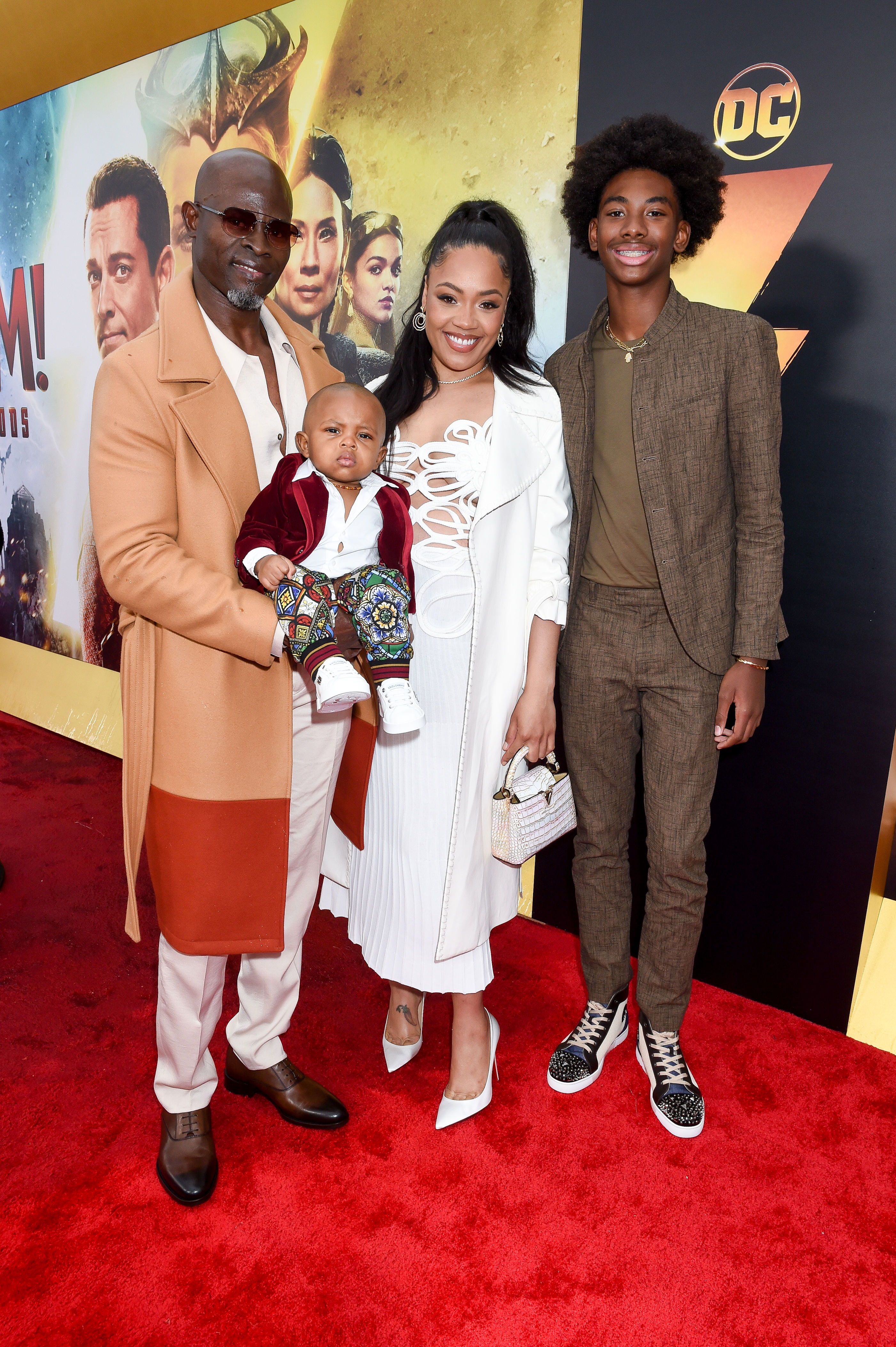 Djimon Hounsou, Ri'za Marie, Fela Hounsou, and Kenzo Lee Hounsou on the red carpet.
