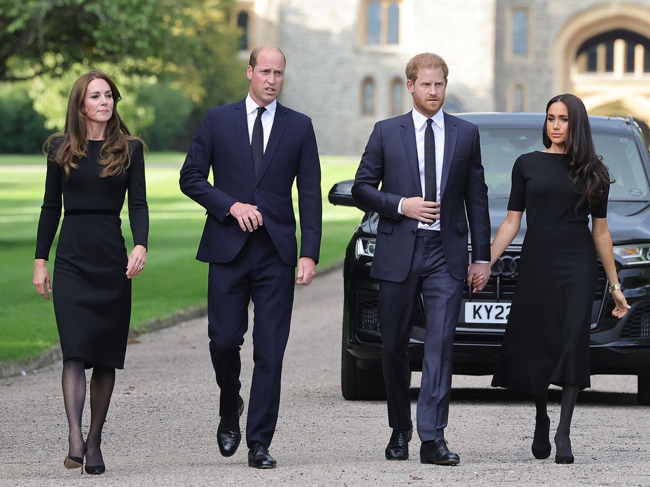 Catherine, Princess of Wales, Prince William, Prince of Wales, Prince Harry, Duke of Sussex, and Meghan, Duchess of Sussex on the long Walk at Windsor Castle arrive to view flowers and tributes to HM Queen Elizabeth on September 10, 2022 in Windsor, England