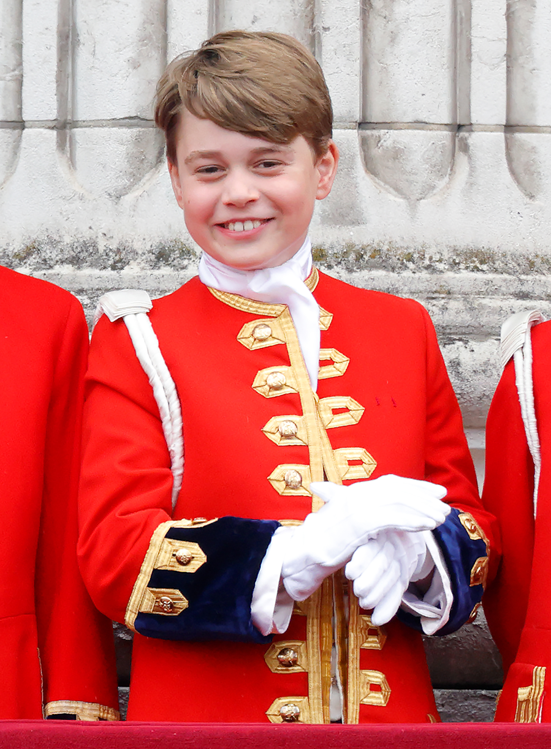 Prince George of Wales (in his role as Page of Honour) watches an RAF flypast from the balcony of Buckingham Palace following the Coronation of King Charles III & Queen Camilla at Westminster Abbey on May 6, 2023 in London, England. The Coronation of Charles III and his wife, Camilla, as King and Queen of the United Kingdom of Great Britain and Northern Ireland, and the other Commonwealth realms takes place at Westminster Abbey today. Charles acceded to the throne on 8 September 2022, upon the death of his mother, Elizabeth II.